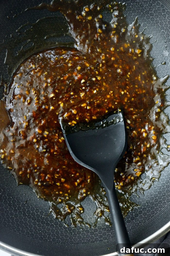 Sticky Sweet Bourbon Chicken 14 Bringing the Bourbon Chicken sauce to a boil to thicken