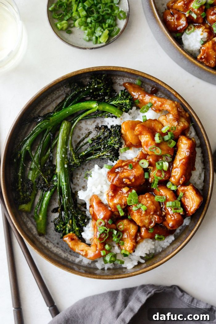 Sticky Sweet Bourbon Chicken 18 Plated Bourbon Chicken with rice and green onions