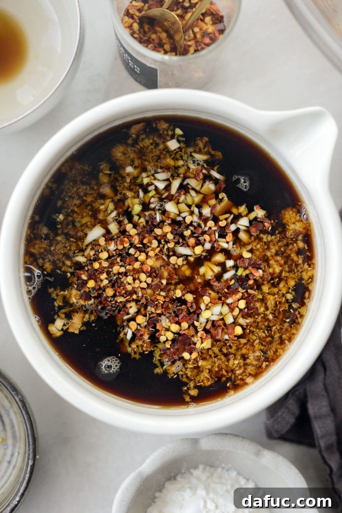 Sticky Sweet Bourbon Chicken 5 Ingredients for Bourbon Chicken sauce in a bowl, ready to be whisked