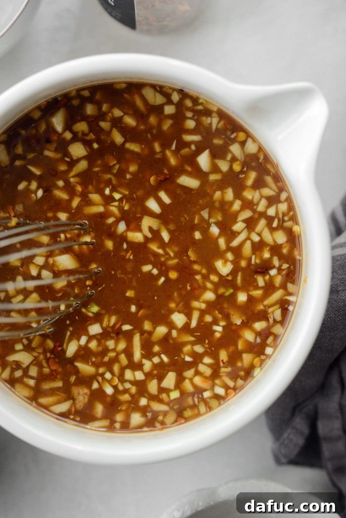 Sticky Sweet Bourbon Chicken 6 Whisking the Bourbon Chicken sauce ingredients together