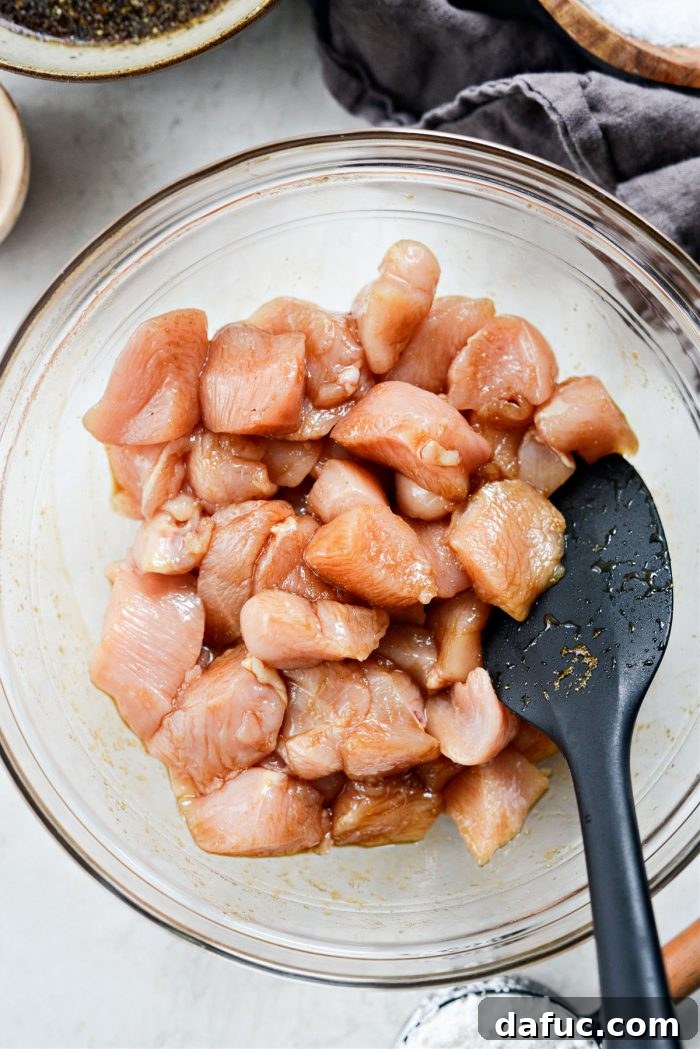 Sticky Sweet Bourbon Chicken 8 Tossing chicken in the marinade