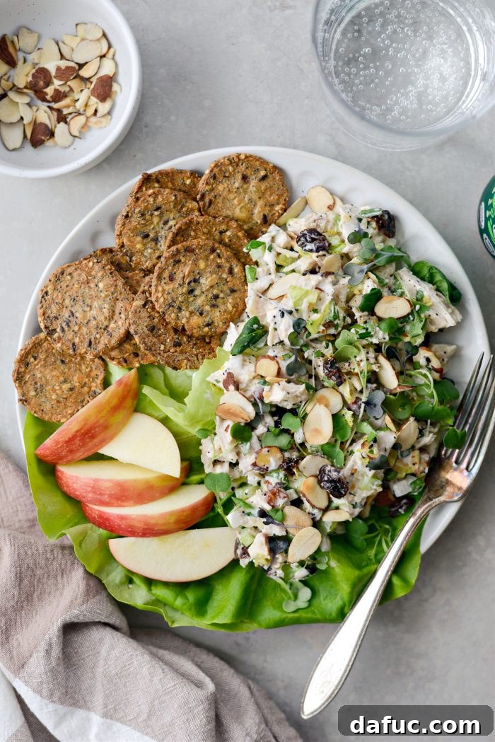 A bowl of Cherry Toasted Almond Chicken Salad, ready for meal prep or immediate enjoyment.