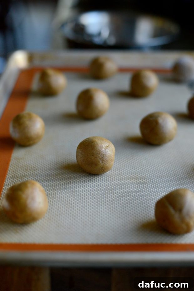 Golden Molasses Chews 12 Preheating oven and preparing baking sheet with a silicone mat.