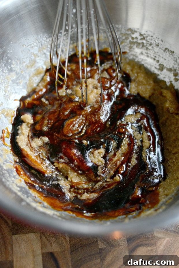 Golden Molasses Chews 7 Whisking wet ingredients until fully combined.