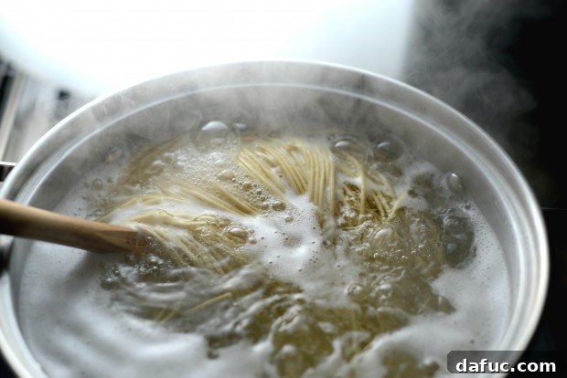 Adding ramen noodles to boiling water