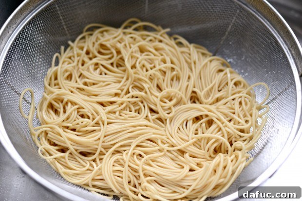 Draining cooked ramen noodles
