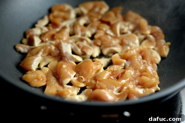 Chicken cooking in a wok