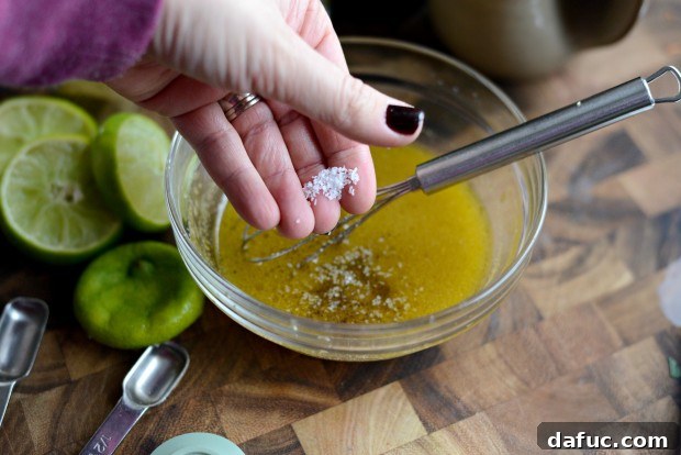 Zesty Cumin Lime Mexican Slaw 15 Seasoning the dressing with salt and pepper