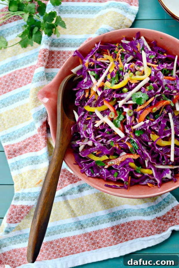 Zesty Cumin Lime Mexican Slaw 3 Close-up of fresh Mexican Slaw with various vegetables