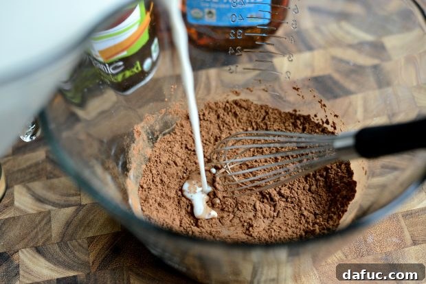 Cool Cocoa Bliss 12 Pouring milk into the measuring cup with other ingredients