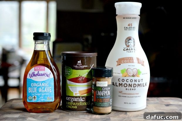 Cool Cocoa Bliss 7 Ingredients for Iced Hot Chocolate on a rustic surface
