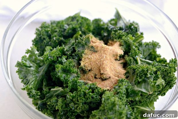 Crunchy Sriracha Garlic Kale Crisps 13 Tossing Kale with Oil for Dehydrator Chips