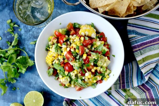 Freshly prepared Avocado Corn Salsa in a bowl, ready to be served with tortilla chips