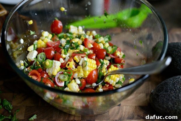 More kosher salt being added to the salsa mixture