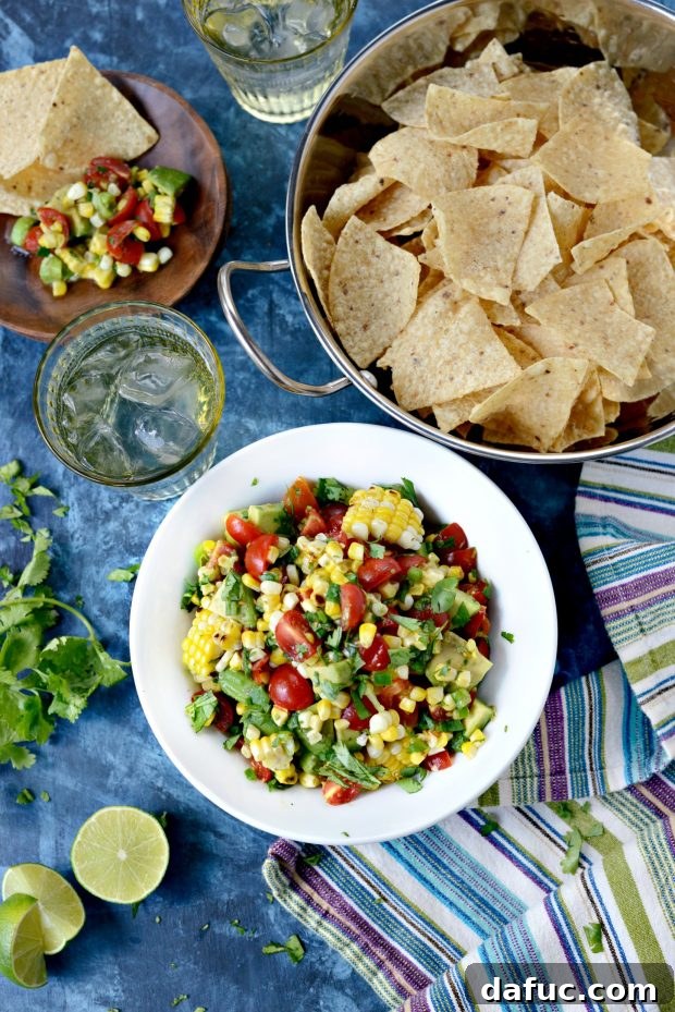 Close-up of a large bowl of Avocado Corn Salsa with tortilla chips, showing texture and ingredients