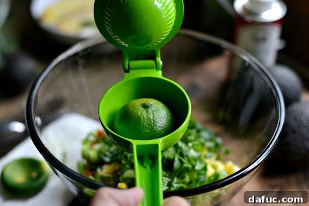 Fresh lime juice being added to the salsa ingredients
