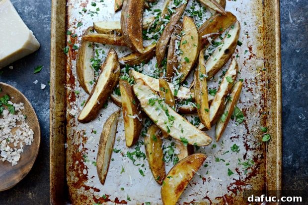 Crispy Garlic Parmesan and Fresh Herb Oven Fries ready to serve