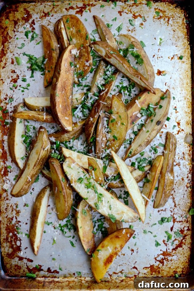 Stack of crispy garlic parmesan and herb oven fries