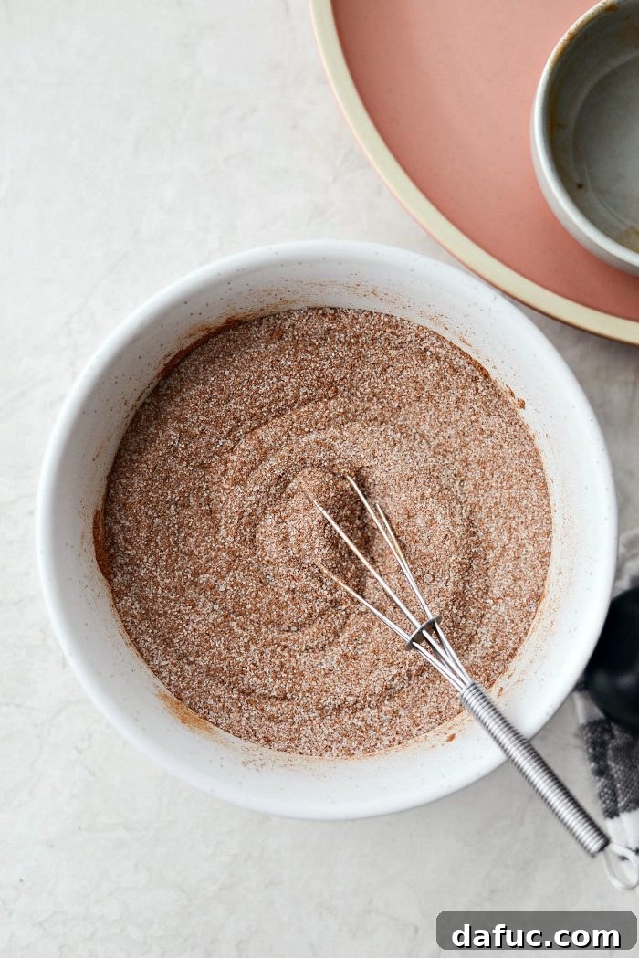Perfectly mixed Homemade Cinnamon Sugar ready for use. Easy, best spice blend recipe from Simply Scratch.