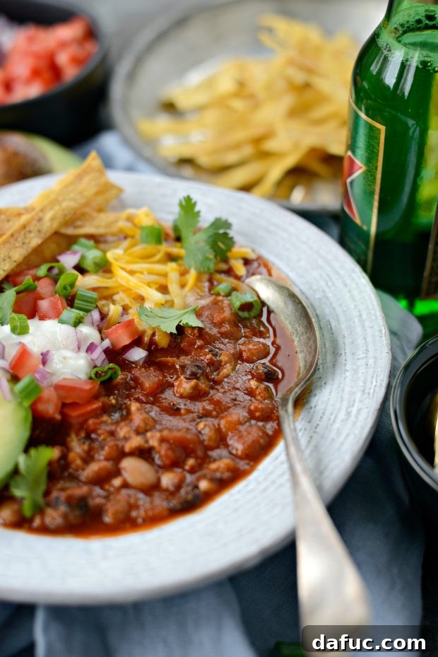 Close up shot of Turkey Taco Beer Chili with various toppings