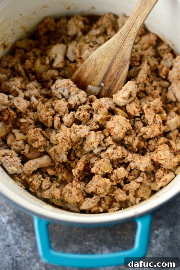 Seasoned cooked ground turkey in a Dutch oven