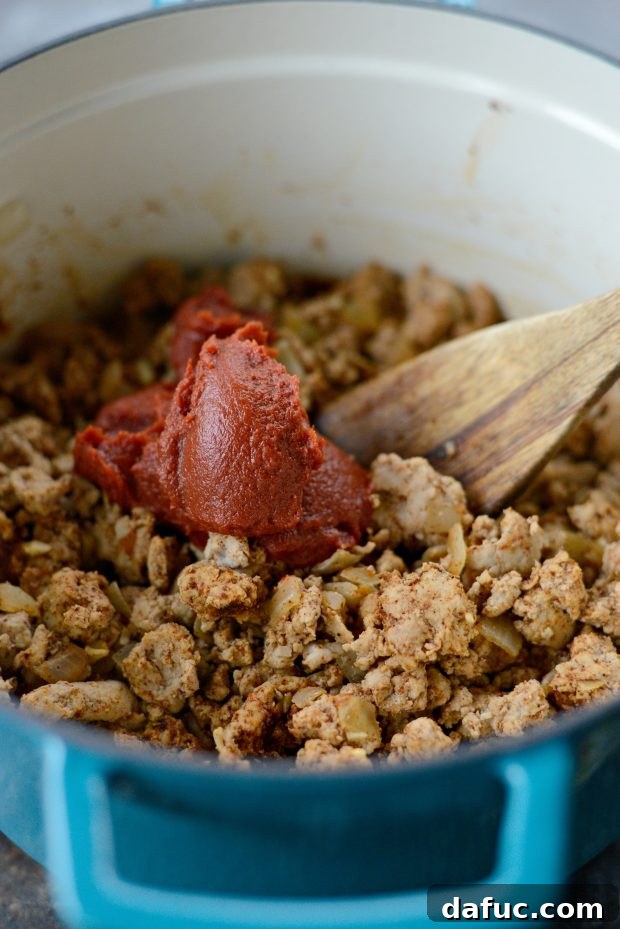 Adding tomato paste to cooked ground turkey and aromatics