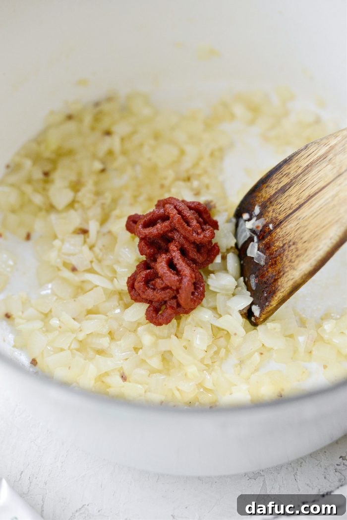 Effortless One-Pan Spaghetti 9 tomato paste added to sauteed onions and garlic