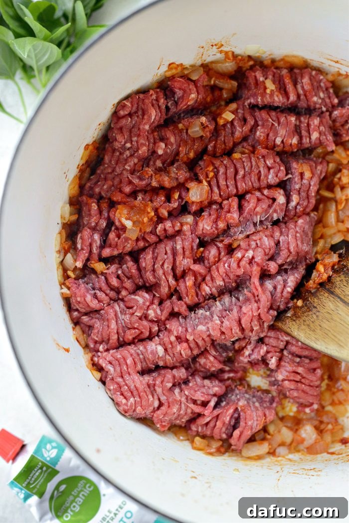 Effortless One-Pan Spaghetti 10 ground beef added to onions and garlic