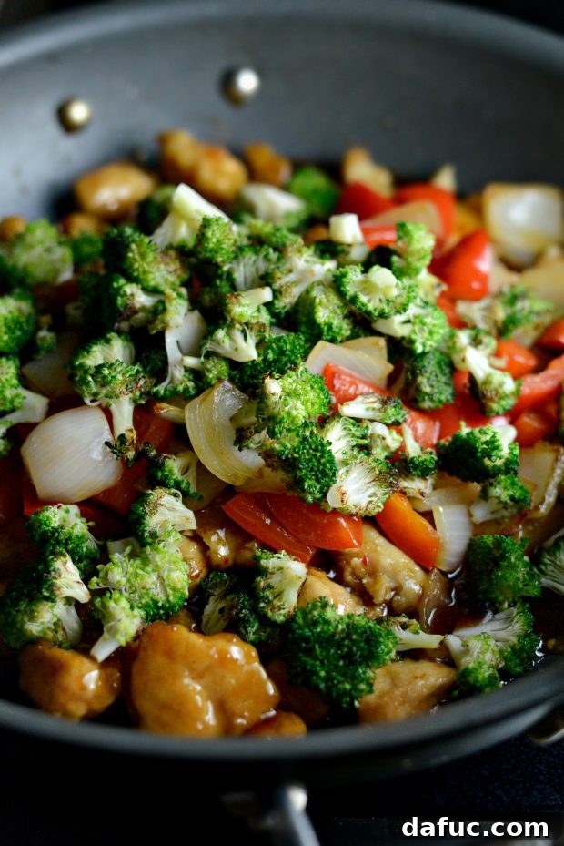 Zesty Ginger Sesame Chicken Stir-Fry 10 Adding vegetables back into the stir-fry