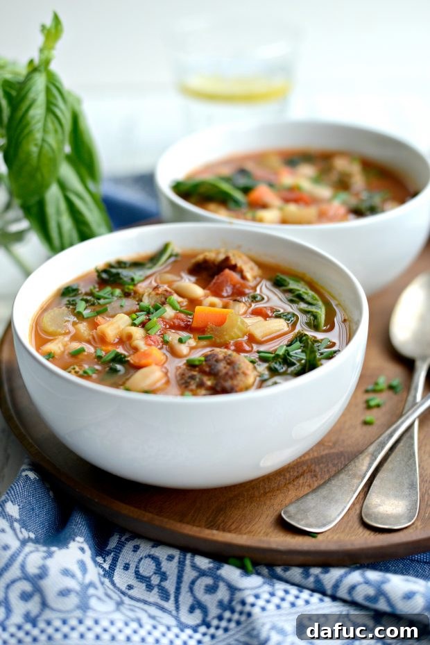 Another view of the delicious Italian Turkey Meatball Minestrone Soup in a bowl, garnished.