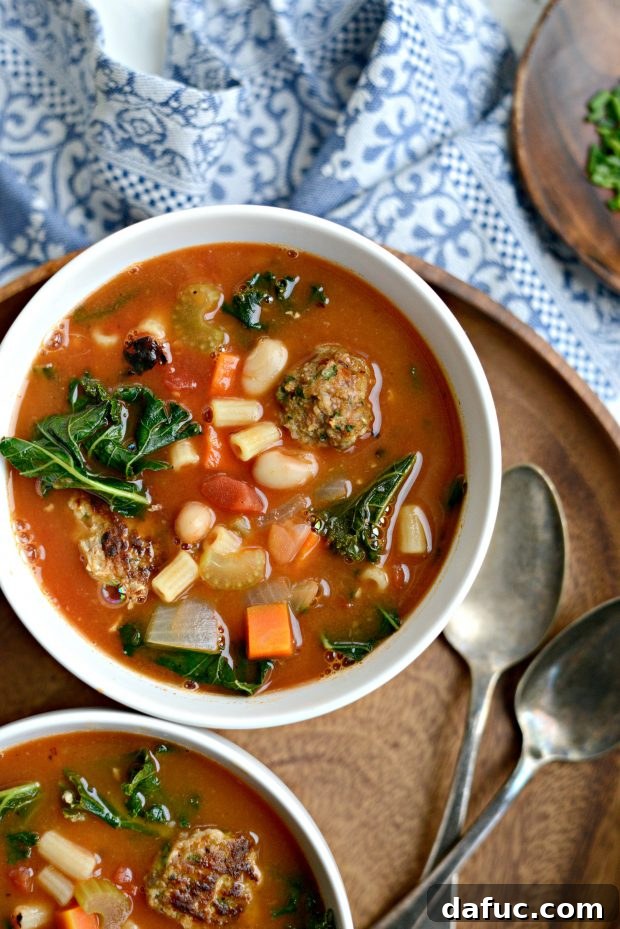 A close-up shot of Italian Turkey Meatball Minestrone Soup in a bowl, showcasing the meatballs, vegetables, and pasta.