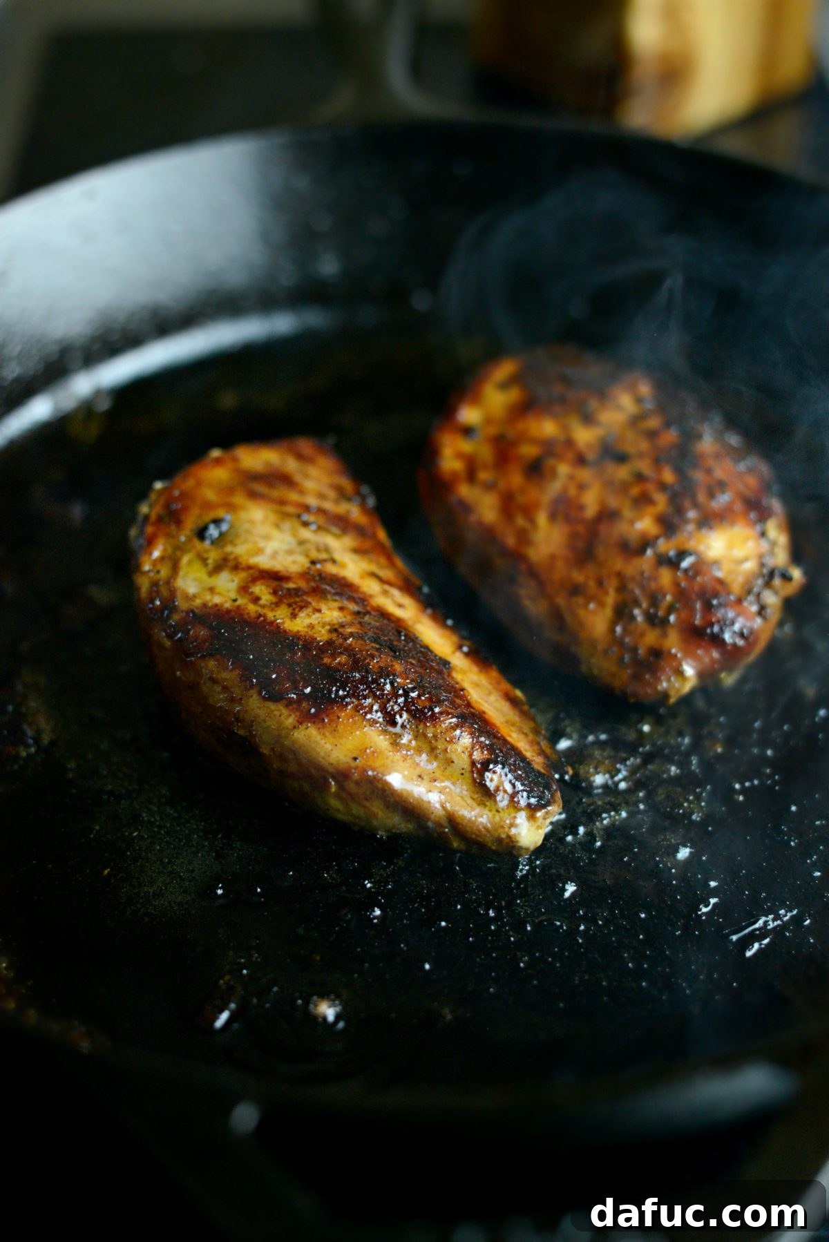 Cooking marinated chicken breasts in a cast iron skillet