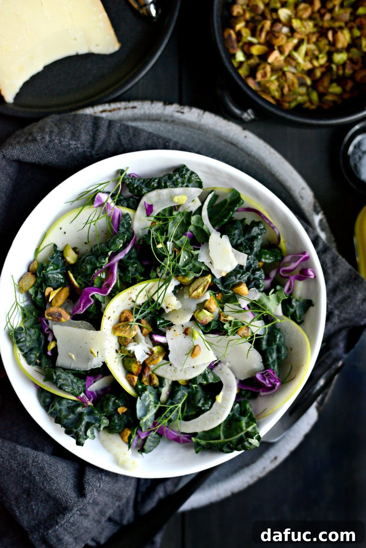 A final close-up shot of the vibrant Kale, Fennel, and Apple Salad.