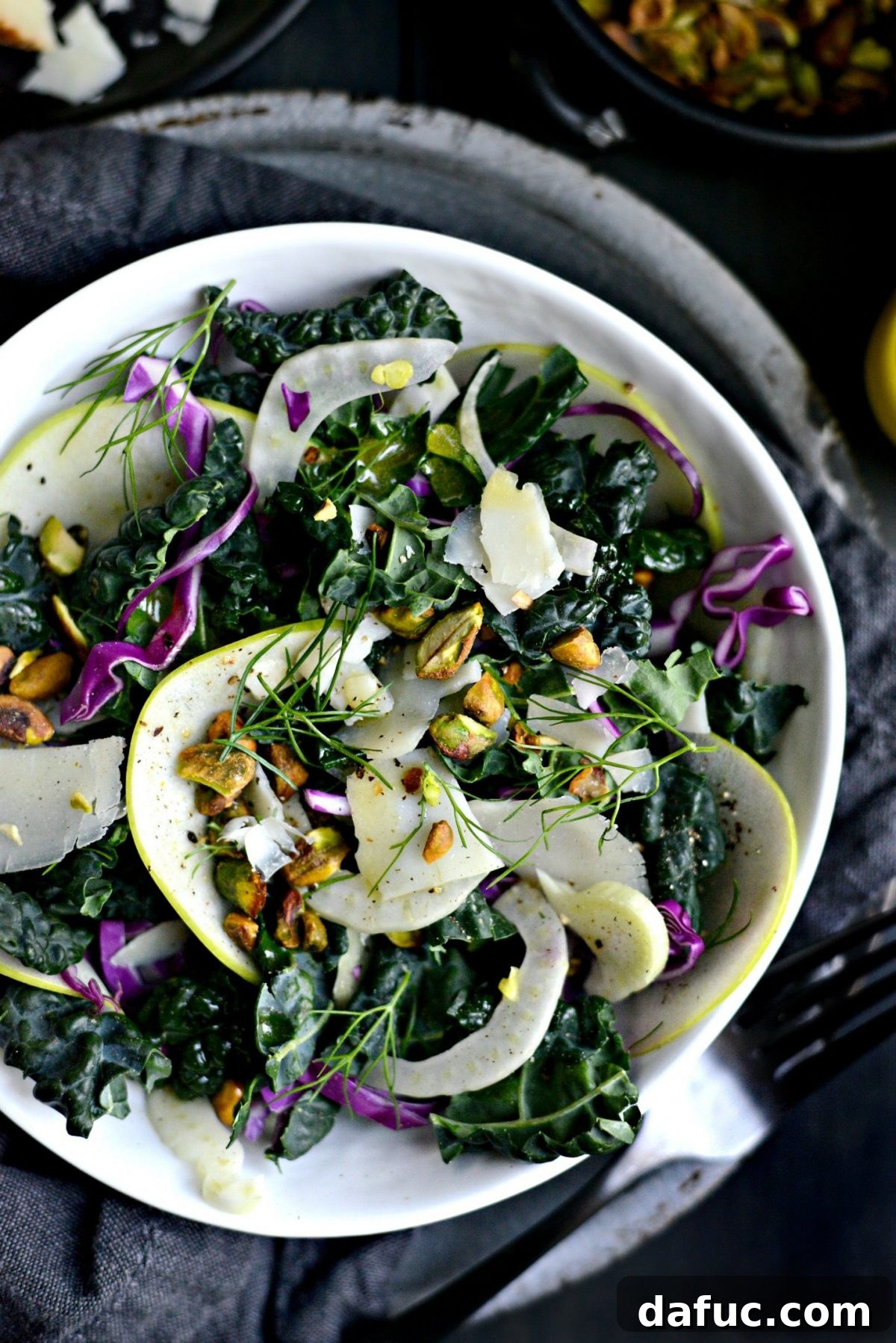 Close-up of freshly prepared Kale, Fennel, and Apple Salad ingredients.