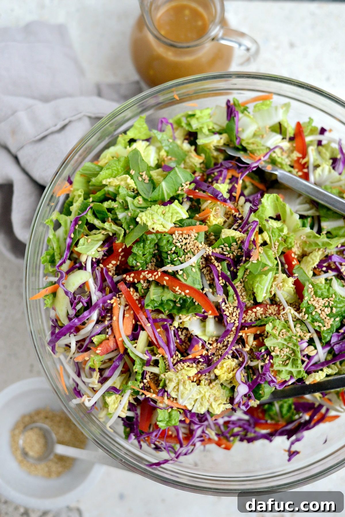 Vibrant Asian Harvest Salad 6 Vegetables being tossed together in a serving bowl