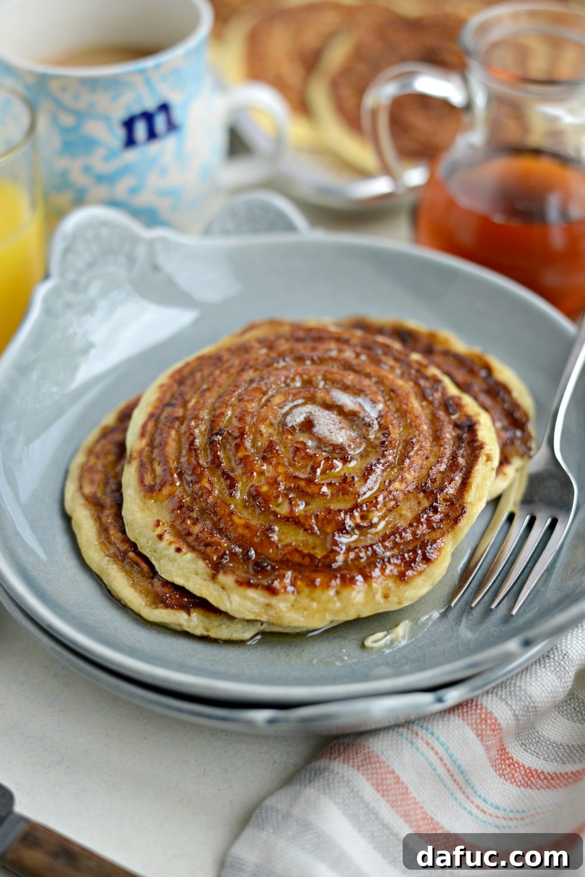 Dreamy Cinnamon Swirl Stacks 19 Close up of Cinnamon Swirl Pancakes with butter and syrup