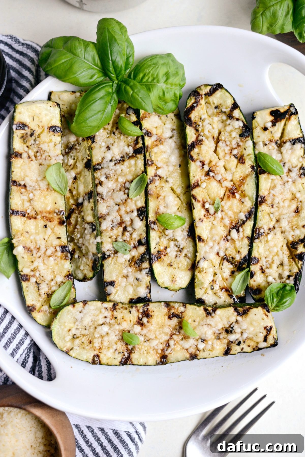 Charred Zucchini with Zesty Lemon, Garlic, and Parmesan 16 Grilled Zucchini with Lemon, Garlic & Parmesan with fresh basil