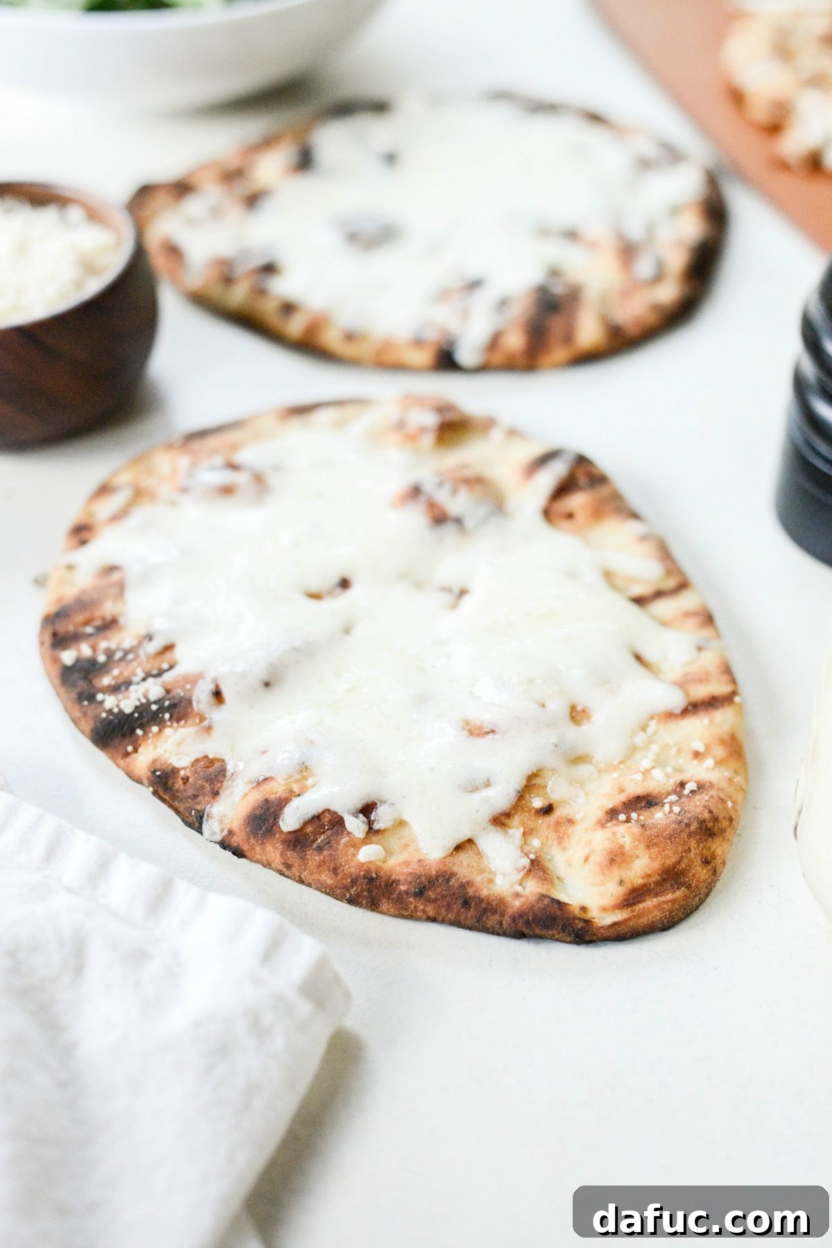 Zesty Grilled Caesar Chicken Pizza 6 grilled naan with melted cheese