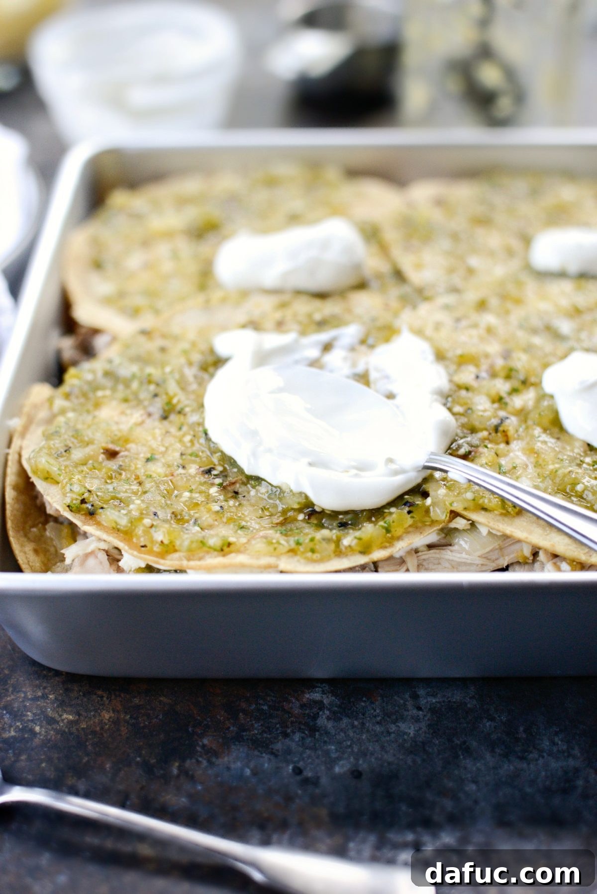 Green Chile Chicken Tortilla Bake 11 Second layer of ingredients assembled in the Salsa Verde Chicken Tortilla Casserole