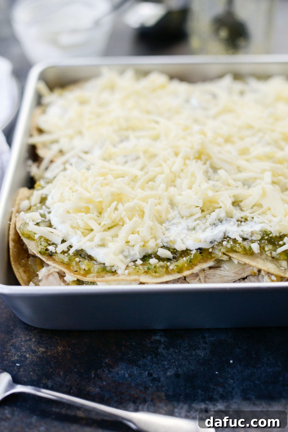 Green Chile Chicken Tortilla Bake 12 Top layer of tortillas with salsa verde and sour cream before final cheese