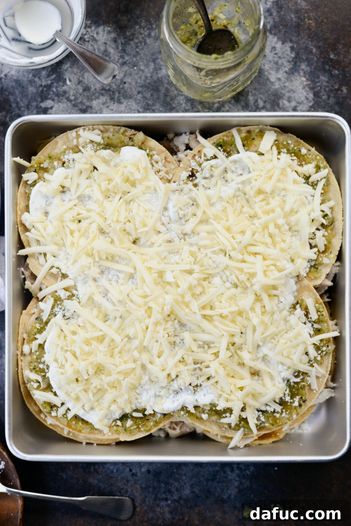 Green Chile Chicken Tortilla Bake 13 Salsa Verde Chicken Tortilla Casserole ready to bake with a final layer of cheese