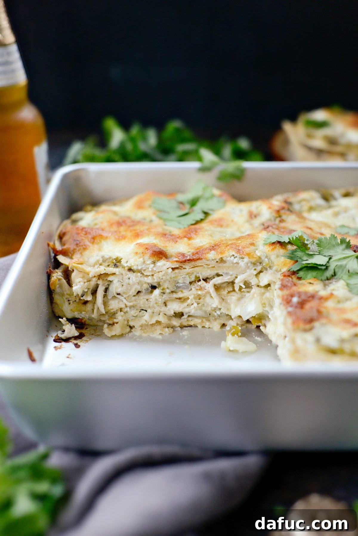 Green Chile Chicken Tortilla Bake 17 Appetizing view of a slice of Salsa Verde Chicken Tortilla Casserole