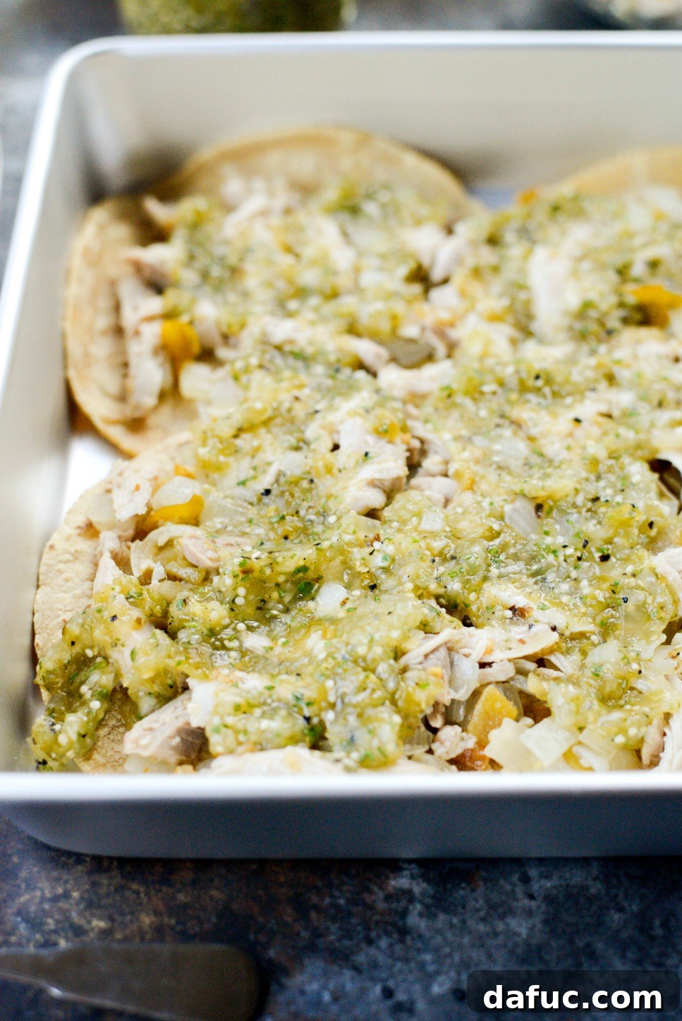 Green Chile Chicken Tortilla Bake 9 Salsa verde spread over the chicken and tortilla layer