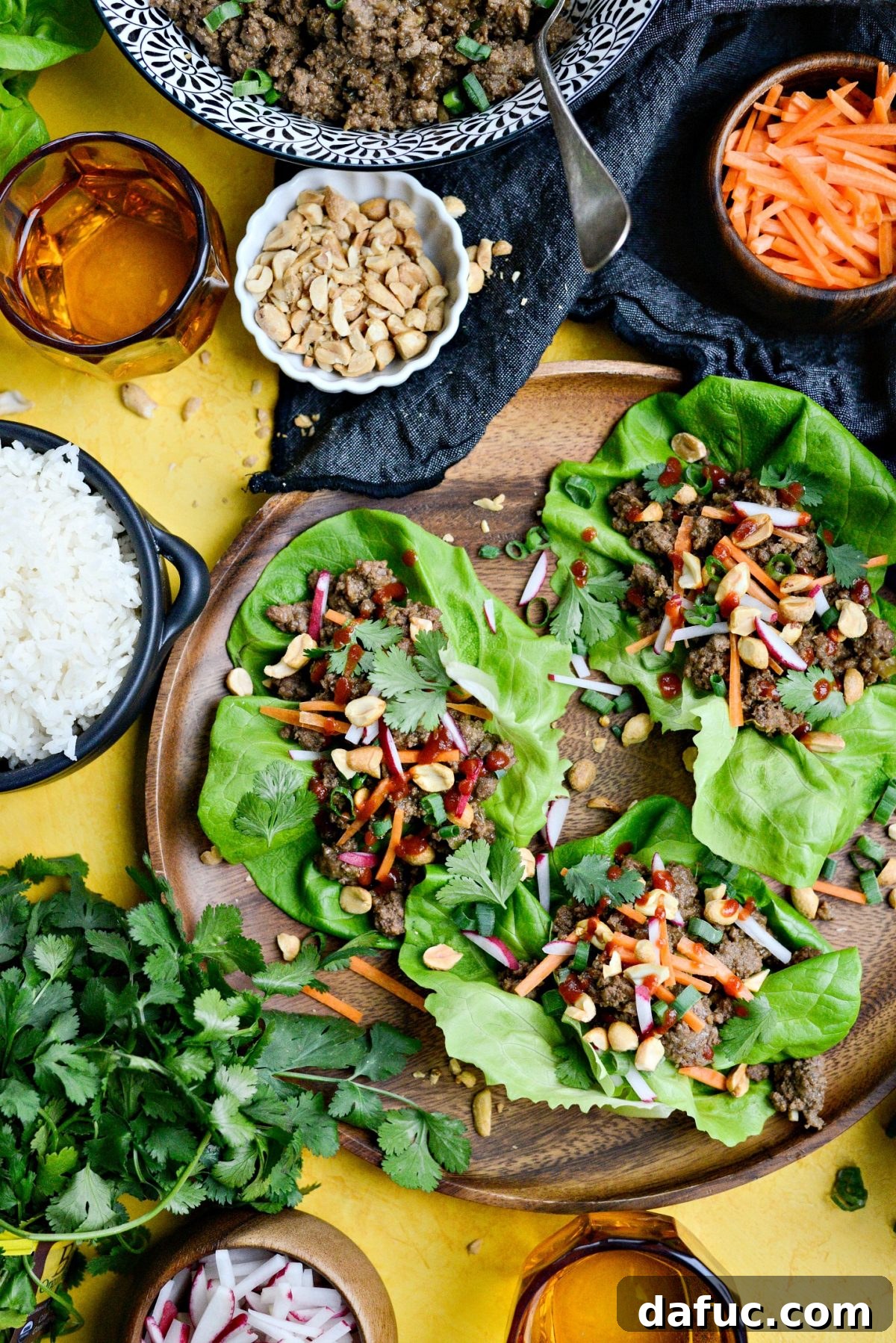 Assembling a fresh and flavorful Ginger Beef Lettuce Wrap.