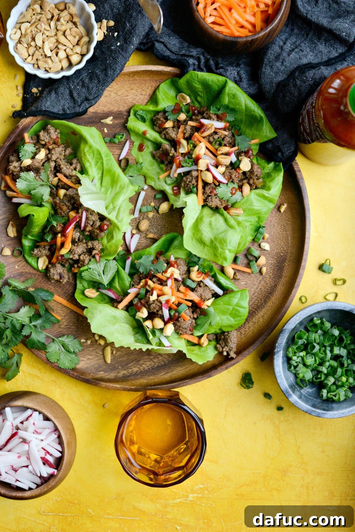 A vibrant platter of Ginger Beef Lettuce Wraps, inviting you to dig in.