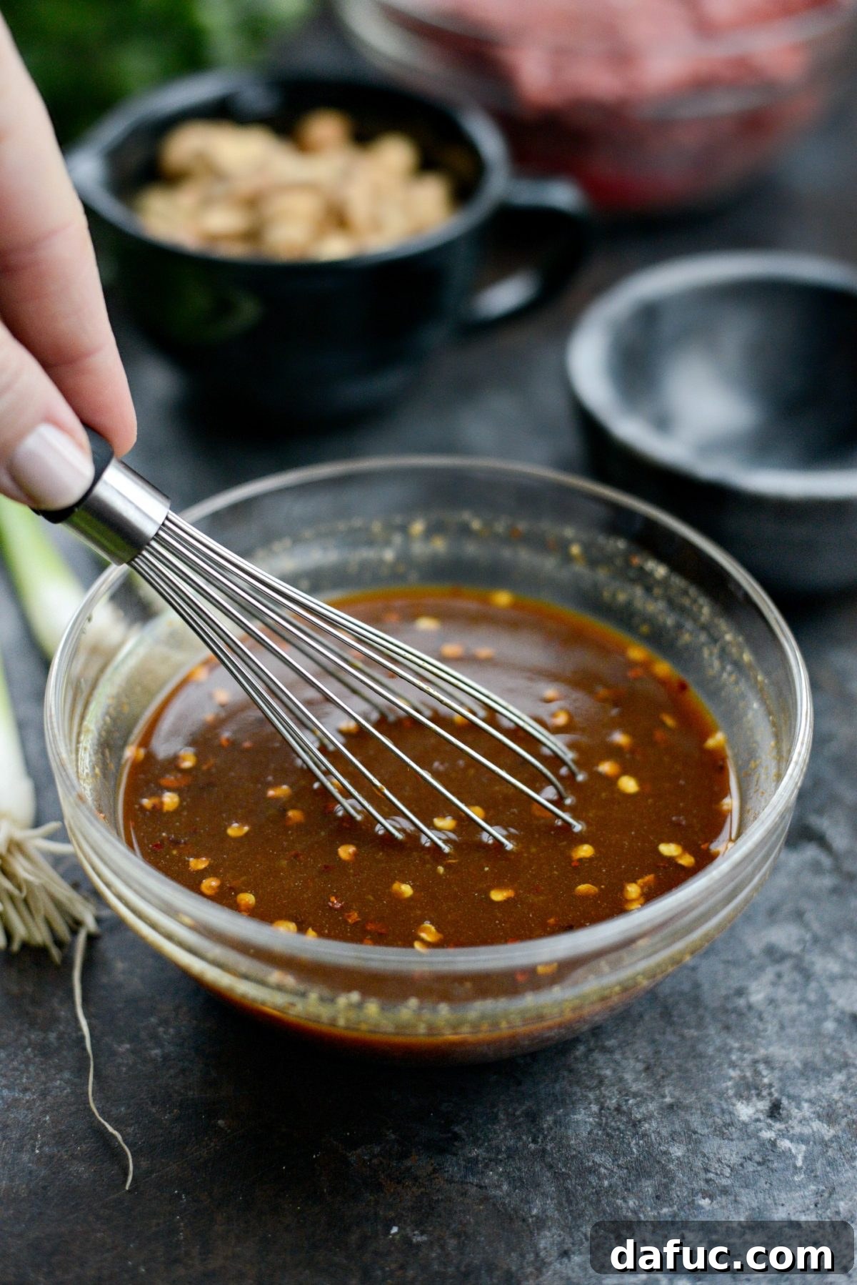 Whisking the sauce to perfection for the lettuce wraps.