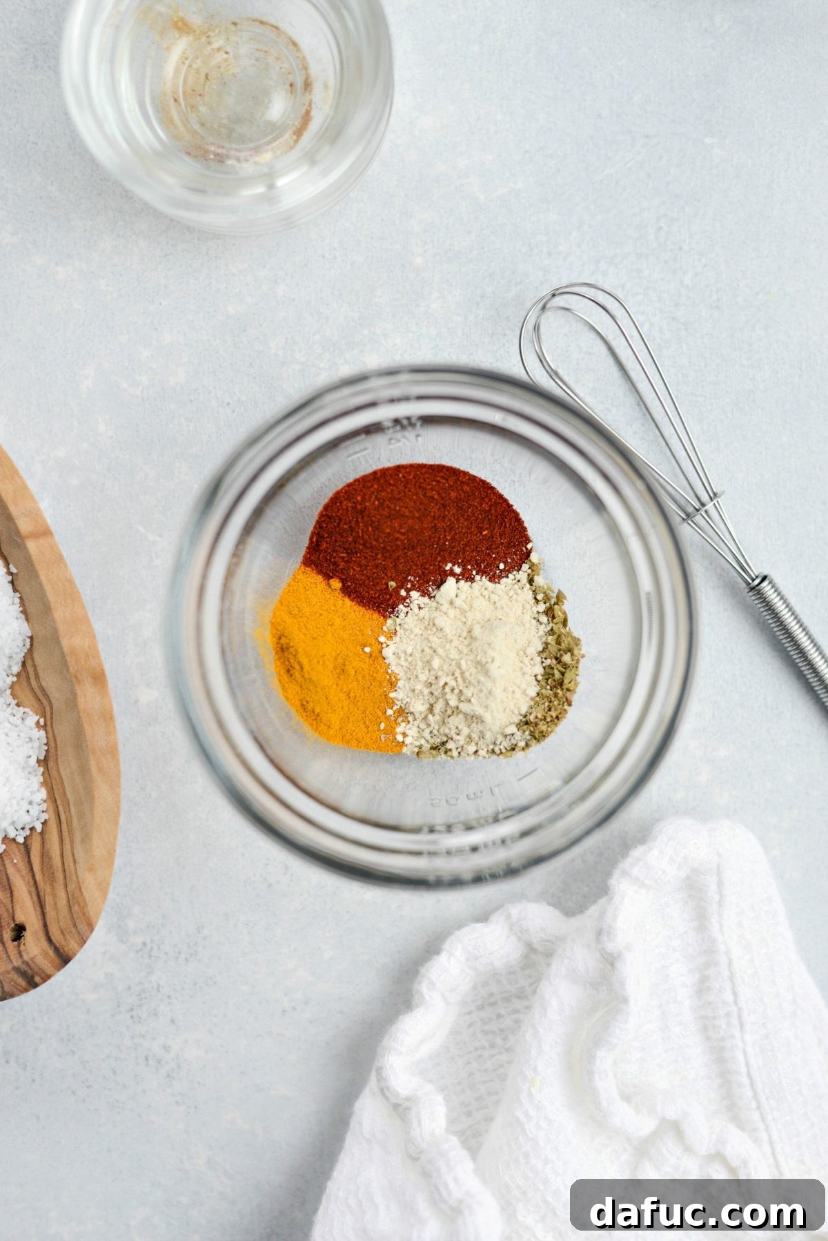 Turmeric Garden Blend 4 Measuring and combining spices in a bowl for the Turmeric Vegetable Seasoning Blend