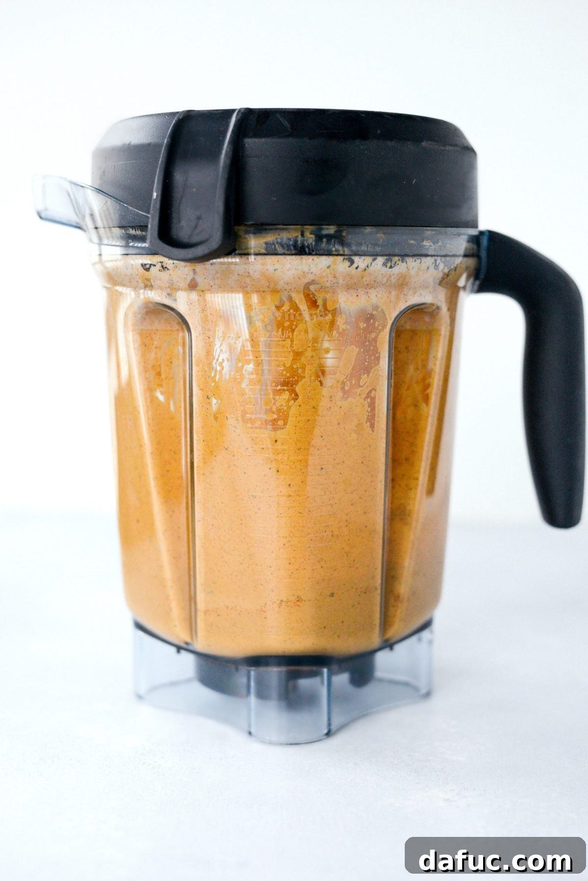 Southwest dressing ingredients actively blending in a high-speed blender