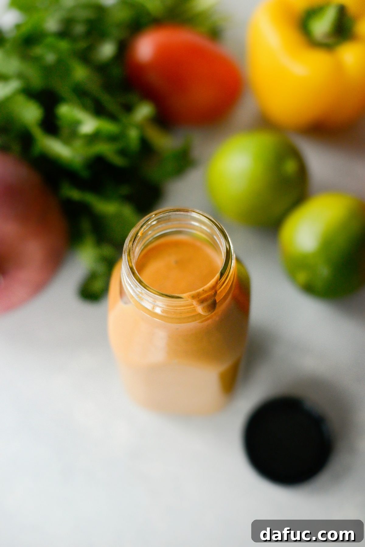 A jar of freshly blended Homemade Southwest Dressing ready for chilling
