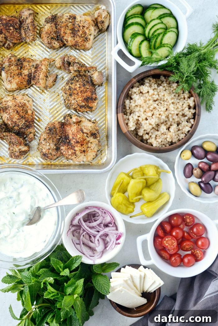 Vibrant Greek Chicken Couscous Bowl 4 Fresh ingredients for Greek Chicken Couscous Bowl laid out